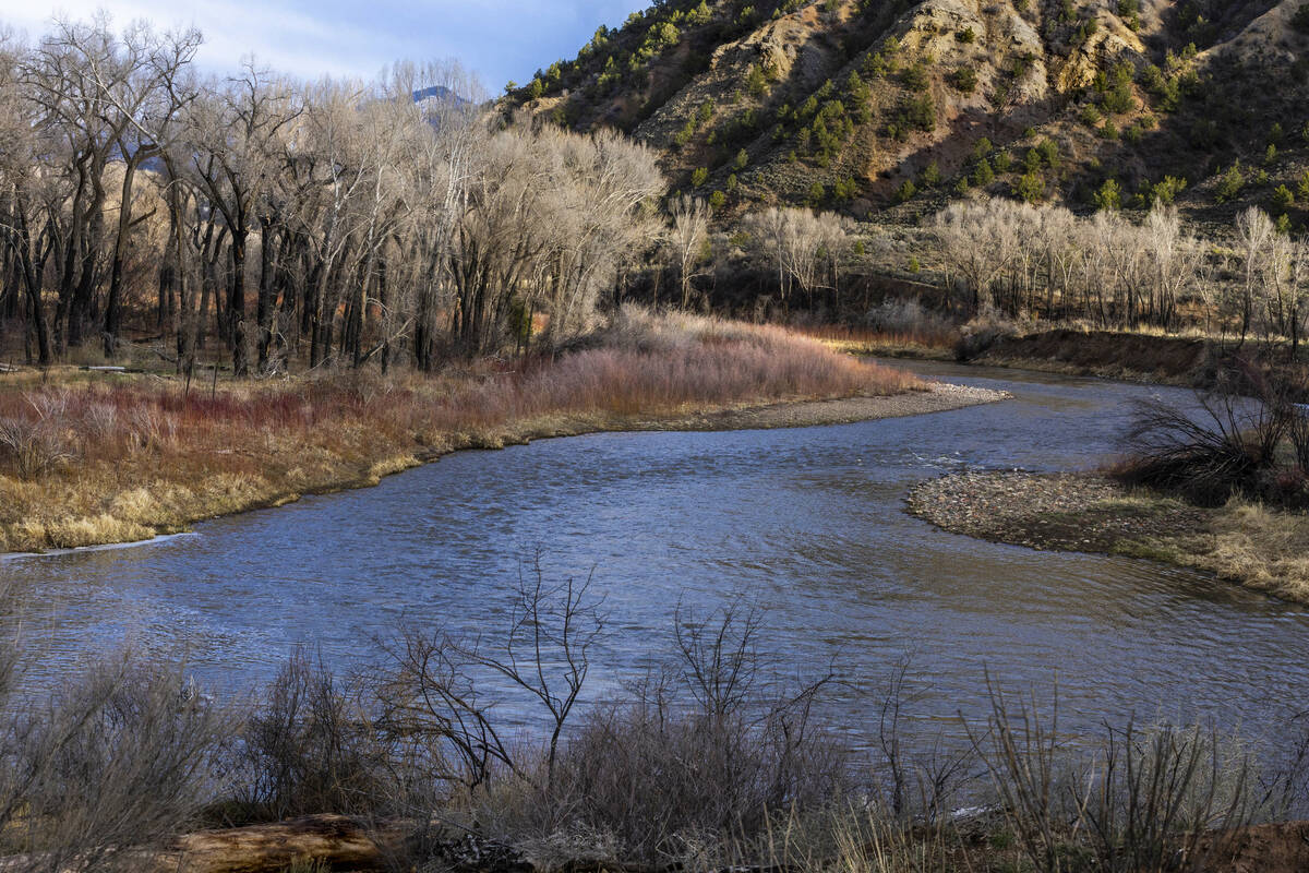 The late-day sun illuminates a campground and the Eagle River, which feeds the nearby Colorado ...