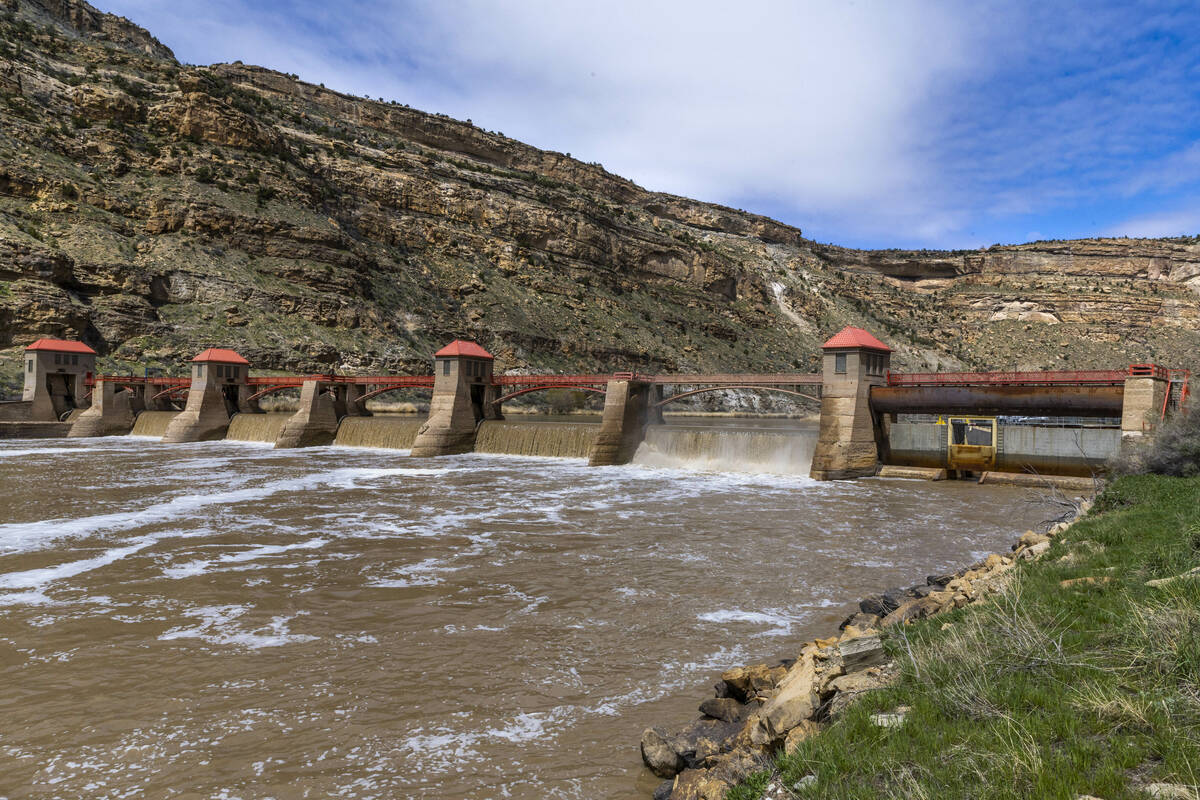 Water flows from the Roller Dam along the Colorado River on April 21, 2023, in Palisade, Colo. ...