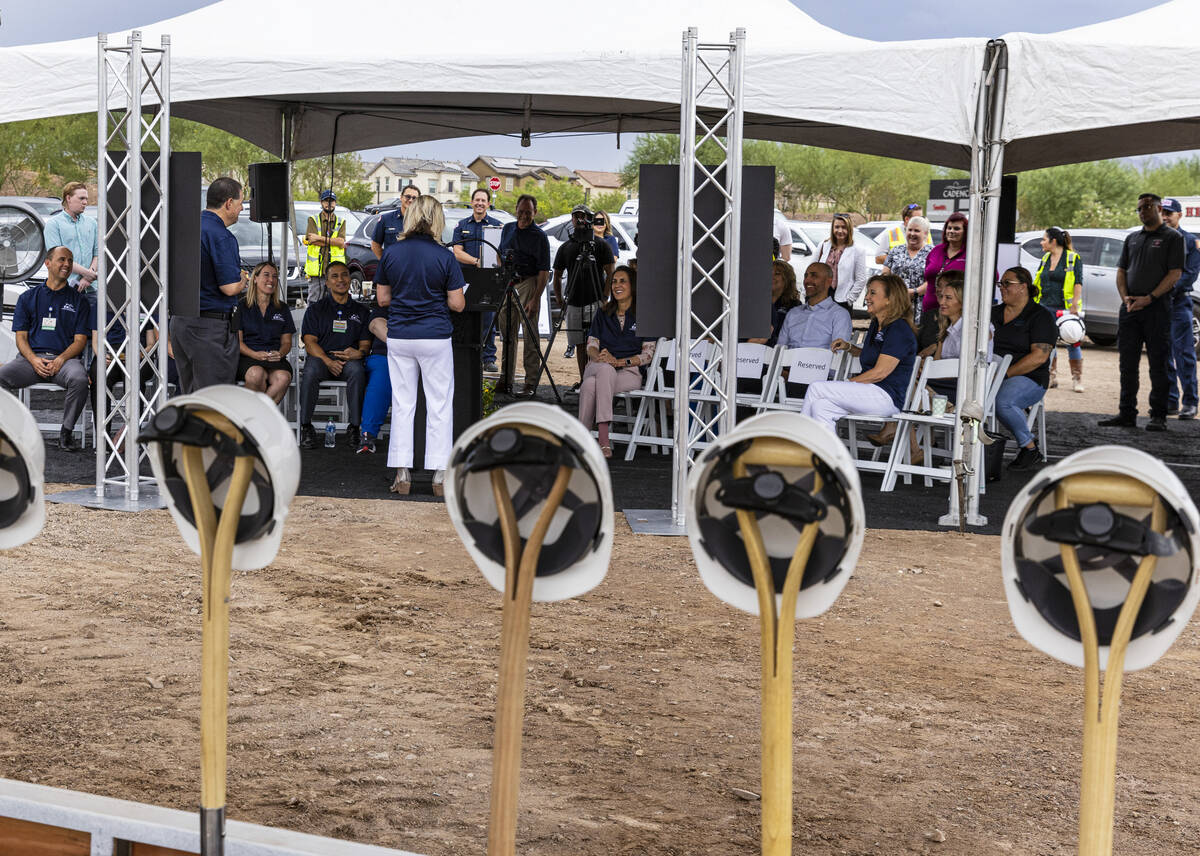 Sam Kaufman, left, CEO of Henderson Hospital, listens as City Of Henderson Mayor Michelle Rome ...