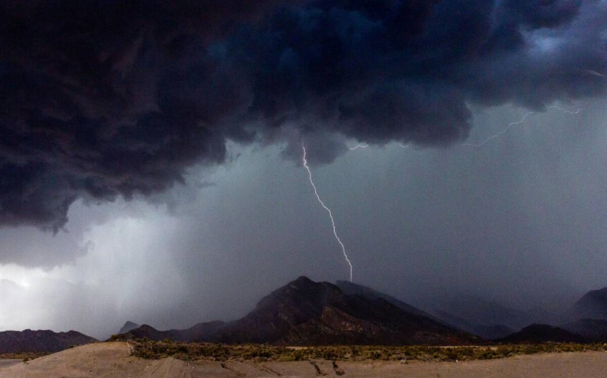 A storm moves through the west hills above Scurry Bend Drive on Tuesday, Aug. 1, 2023, in Las V ...