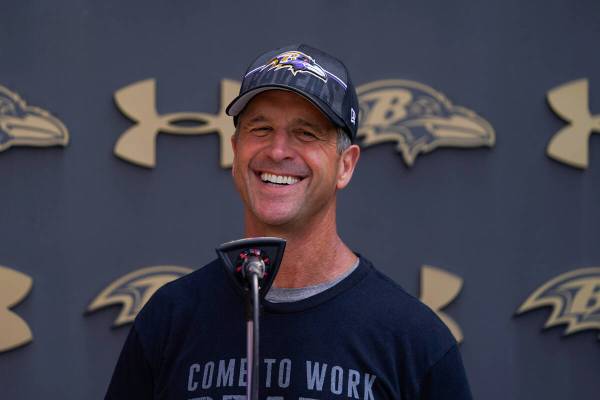 Baltimore Ravens head coach John Harbaugh speaks to reporters during his team's NFL football tr ...