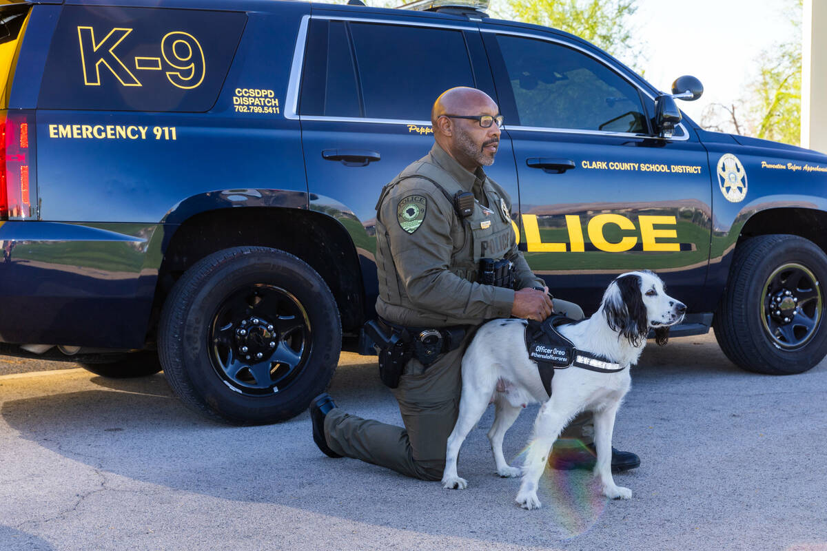 Clark County School District Police Department's K-9 officer Anthony Cooke with dog Oreo have t ...