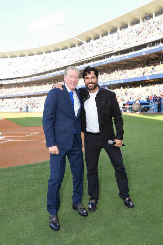 Dodger great Orel Hershiser and Vegas showman Frankie Moreno are shown at Dodger Stadium during ...