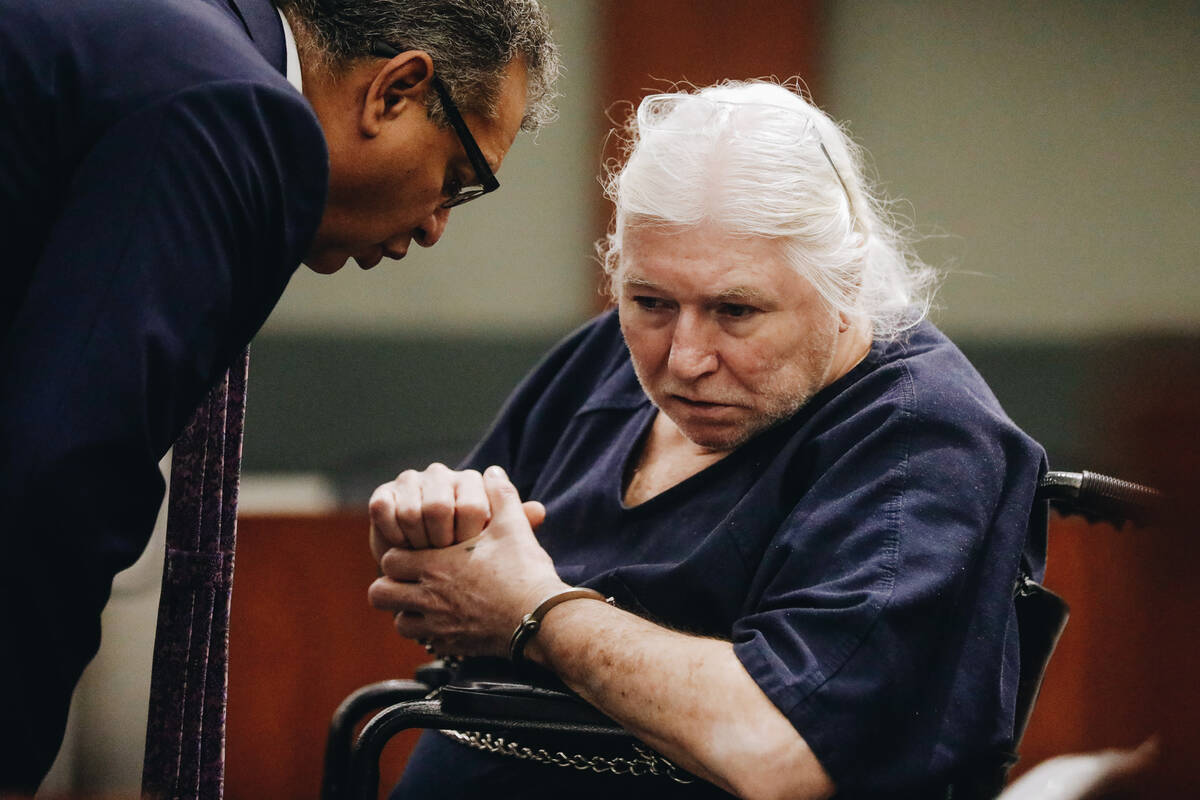 Thomas Randolph speaks to one of his attorneys, Christopher Oran, during a court appearance at ...