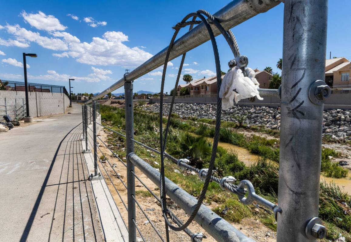 Cable is wrapped about a fence line near where Angel Naranjo recently died from injuries to his ...