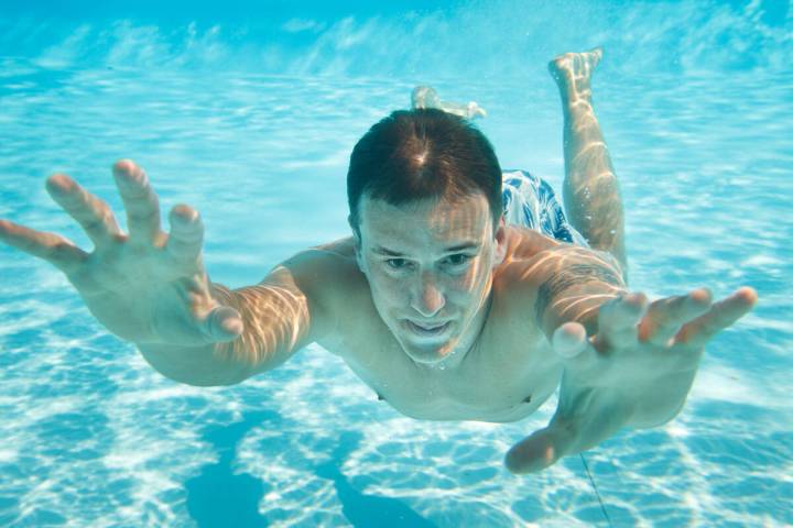 The occasional glance should be OK, but extended eye-opening underwater at the pool can cause d ...