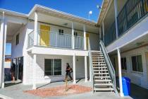 A woman walks past rooms at the grand opening of the Navigation Center, a location where unhous ...