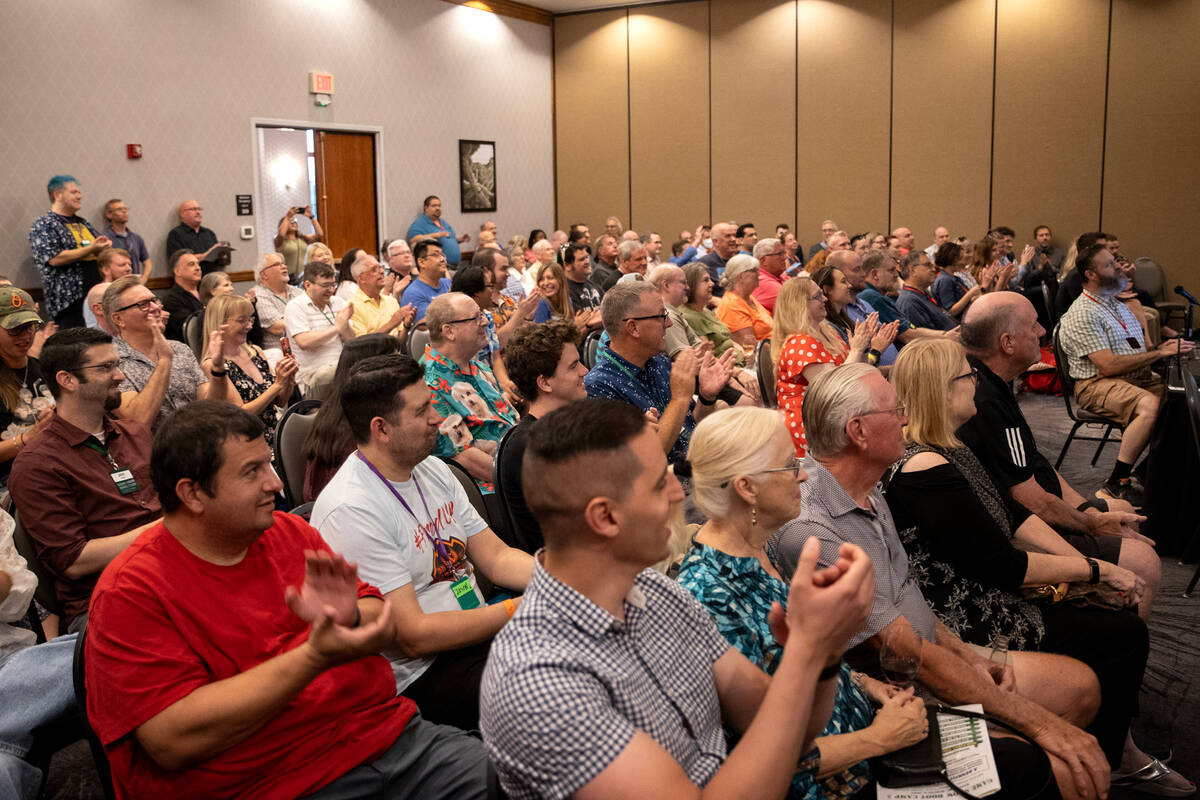 The audience claps for contestants during live trivia game Titan Throwdown 2 at Hampton Inn Tro ...