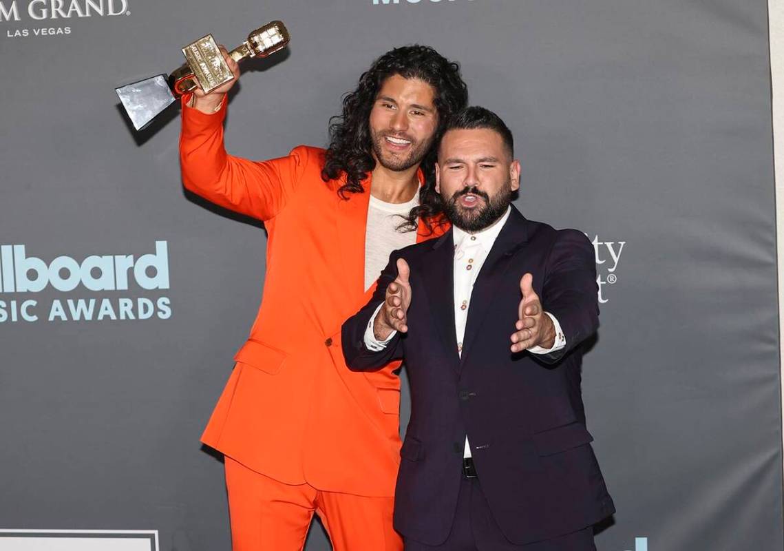 Dan Smyers, left, and Shay Mooney, of duo Dan + Shay, pose with the award for “Top Country Du ...