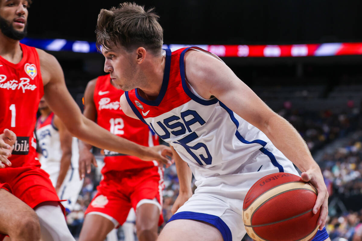 USA Basketball Men’s National Team guard Austin Reaves (15) drives the ball to the hoop ...