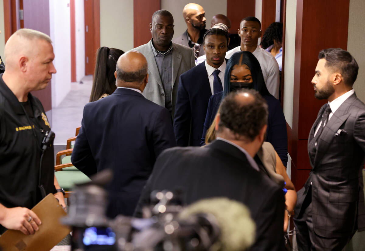 Former Raiders wide receiver Henry Ruggs, center, arrives in court at the Regional Justice Cent ...