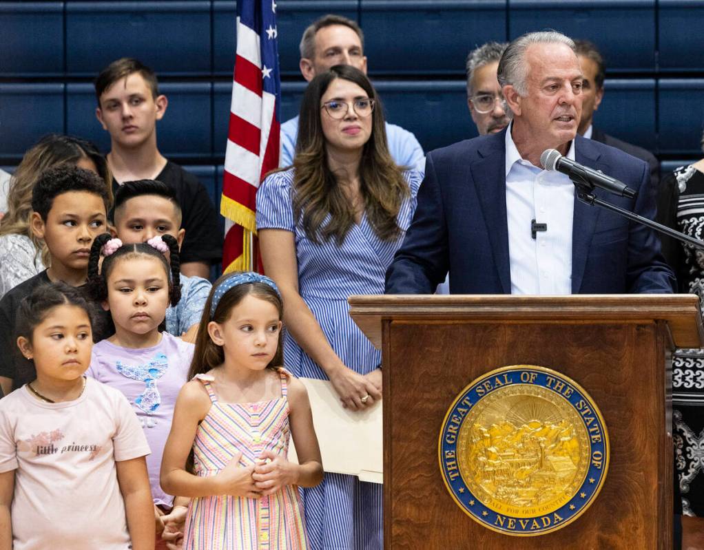 Gov. Joe Lombardo speaks during a "school choice" rally as Valeria Gurr, left, Nevada School Ch ...