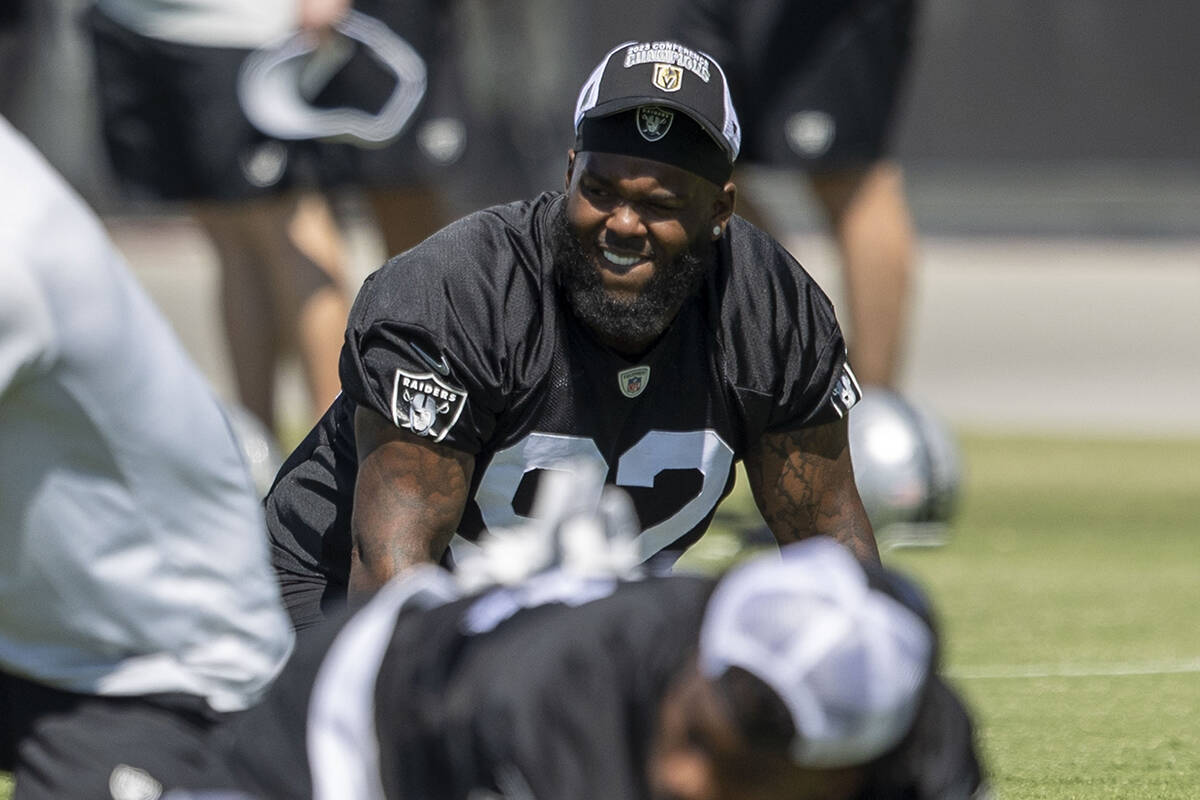 Raiders defensive tackle Neil Farrell Jr. (92) stretches during an organized team activity at I ...