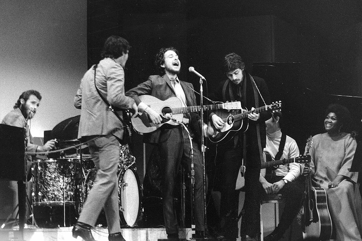 FILE - In this Jan. 20, 1968 file photo, Bob Dylan, center, performs with drummer Levon Helm, l ...