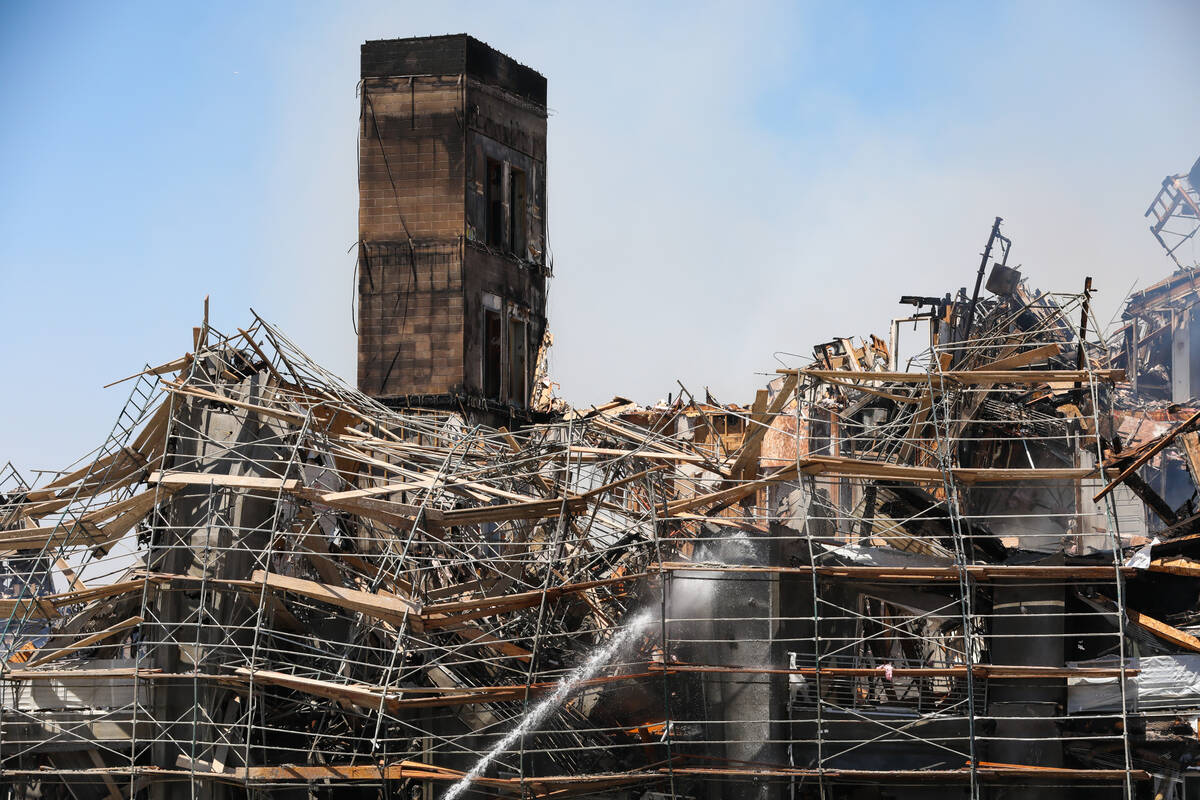 Firefighters work on a fire in an apartment complex under construction at 8030 W. Maule Ave. on ...