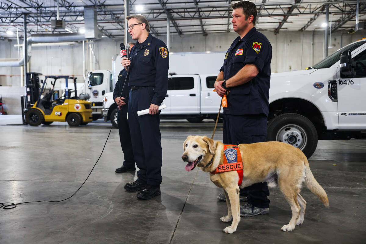 Fire Chief John Steinbeck addresses media next to Donovan Kutsenda, search team manager, and K- ...