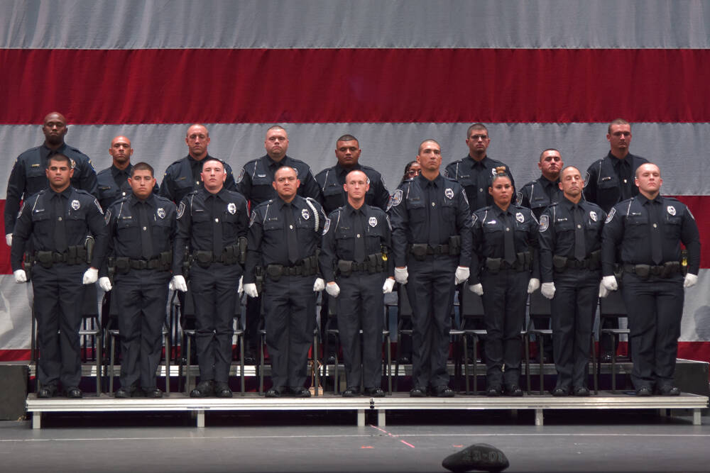 The graduating class of officers for the North Las Vegas Police and the CCSD Police pose with t ...