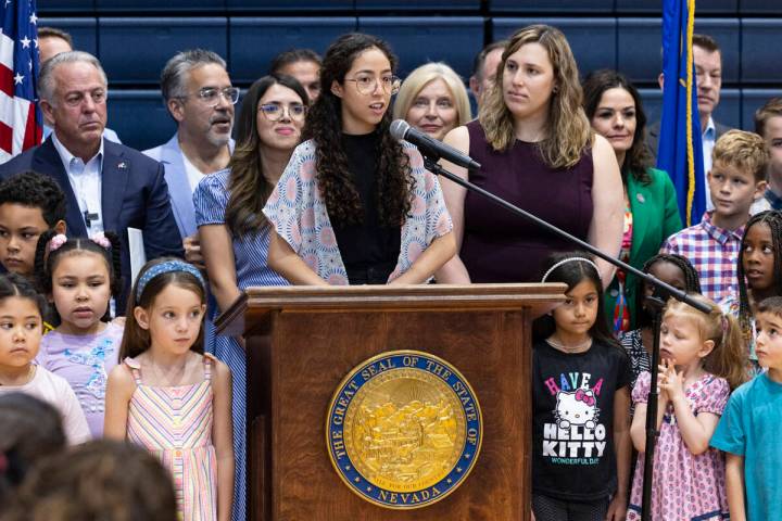 Julia Manzano, one of the Opportunity Scholarship recipients, speaks as Gov. Joe Lombardo, left ...