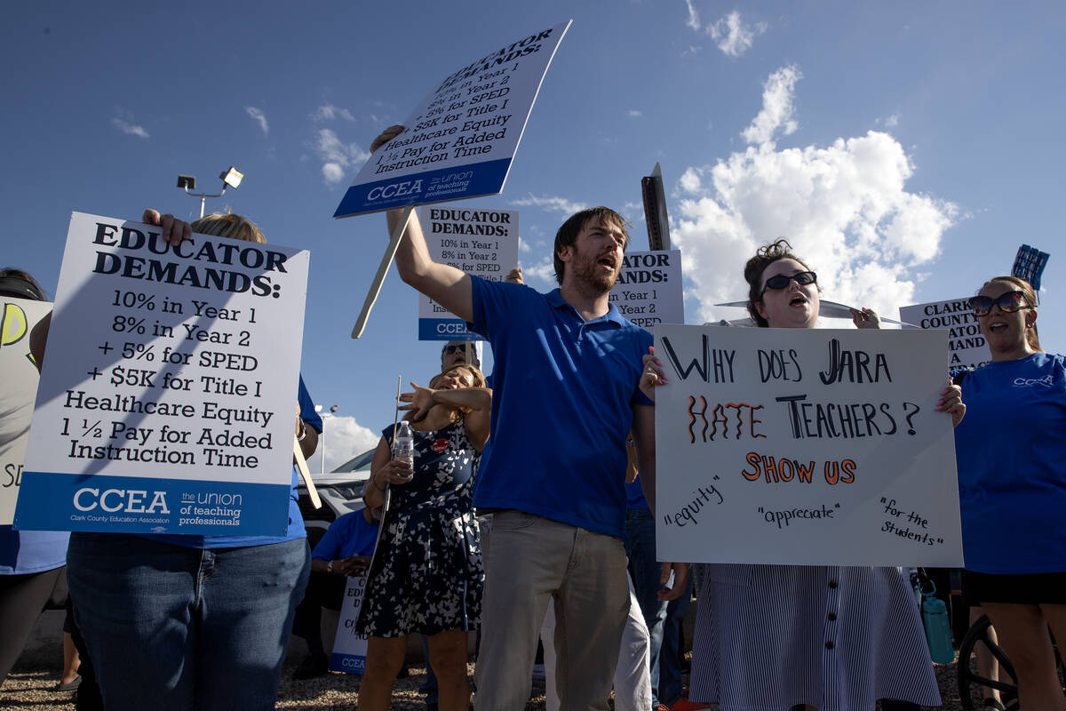 CCEA teachers union members protest outside CCSD’s Greer Education Center on Thursday, Aug. 1 ...