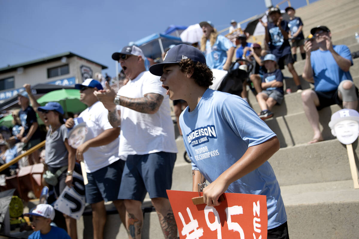 Henderson fans cheer for their team during the Little League West Regional final baseball game ...