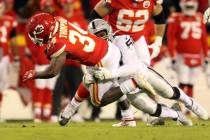 Oakland Raiders linebacker Nicholas Morrow (50) tackles Kansas City Chiefs running back Darwin ...