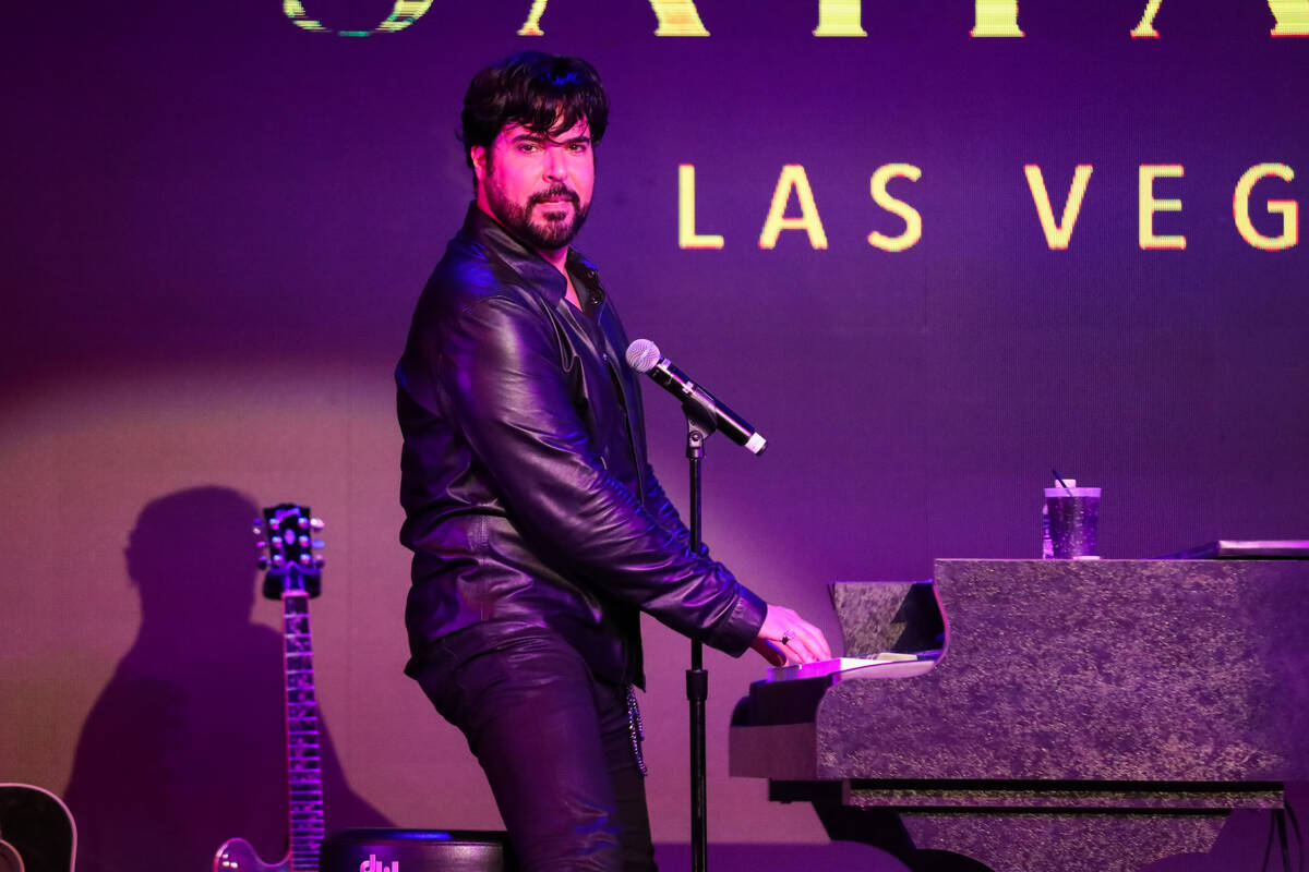 Frankie Moreno looks out upon the audience has he plays the piano during his show, The King of ...