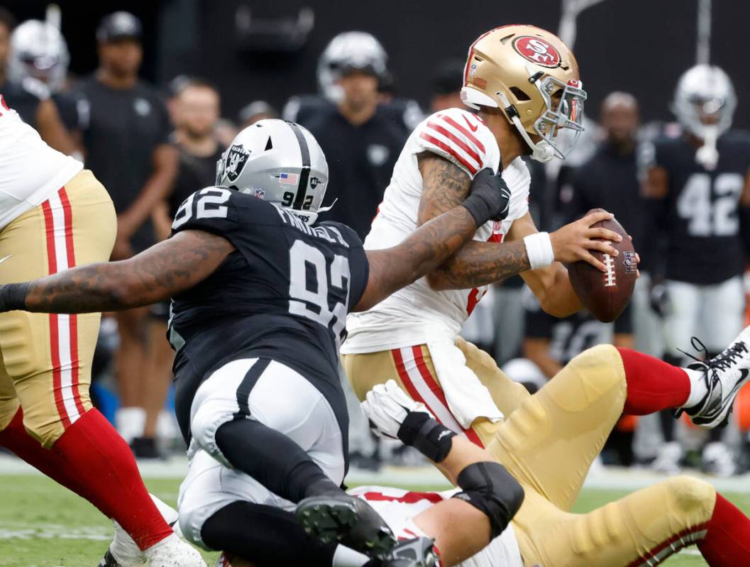 Raiders defensive tackle Neil Farrell Jr. (92) defends the San Francisco 49ers quarterback Trey ...