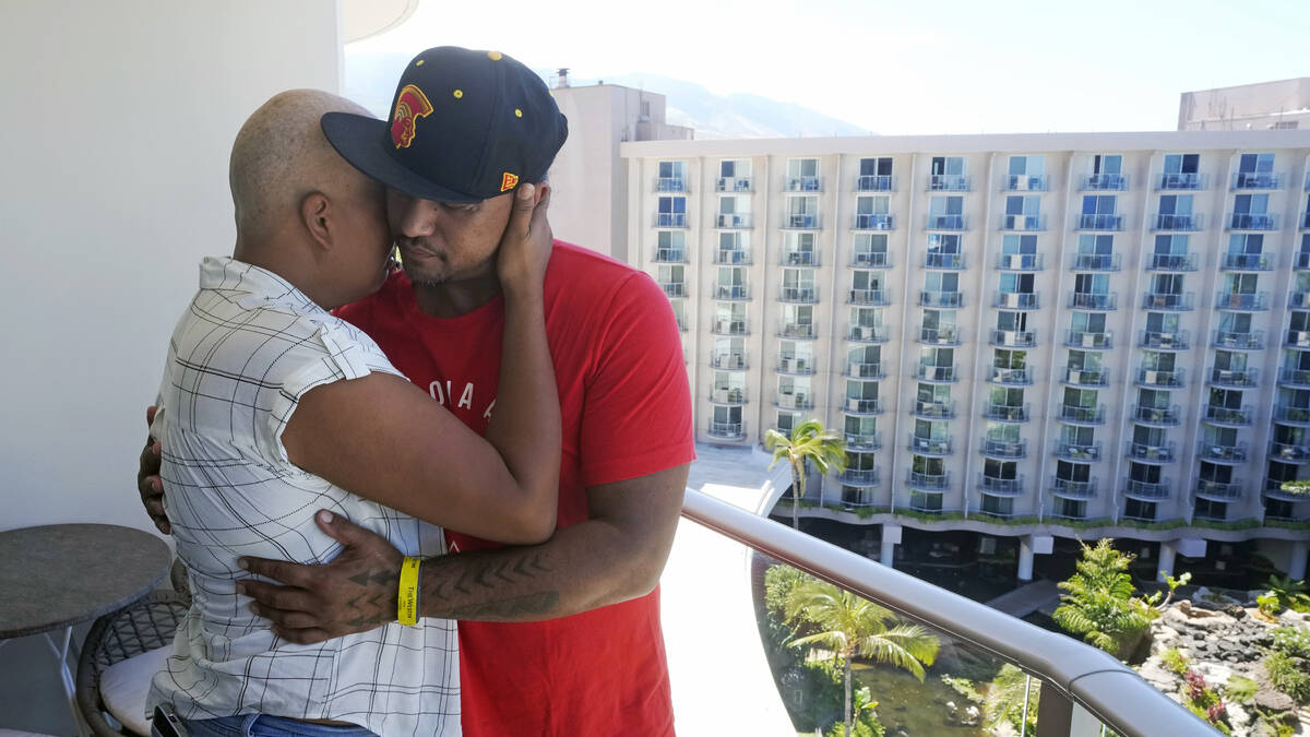 J.P. Mayoga, right, a chef at the Westin Maui, Kaanapali, and his partner, Makalea Ahhee, hug o ...