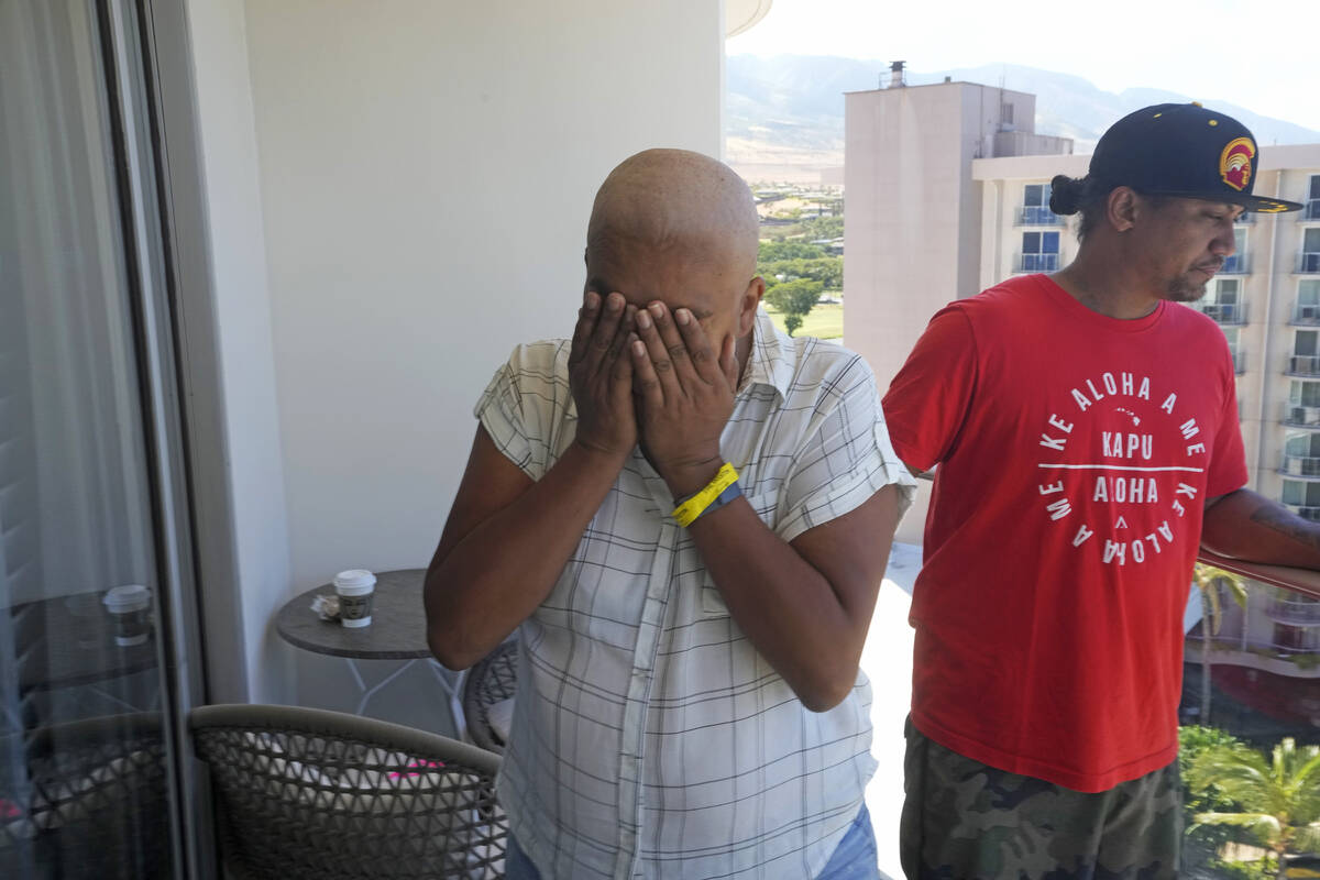 Makalea Ahhee, left, tears up while her partner, J.P. Mayoga, right, a chef at the Westin Maui, ...