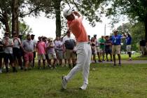 Collin Morikawa hits from the rough on the ninth green during the first round of the St. Jude C ...