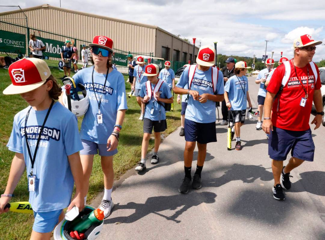 Henderson Little League players head to team's barracks after practice as they prepare for the ...