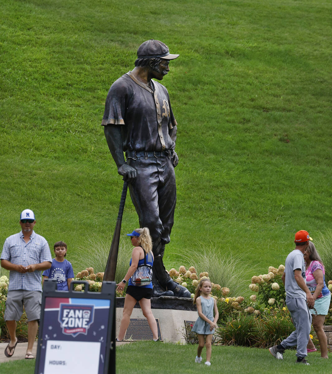 Fans walk past the Casey at the Bat Statue at Howard J. Lamade Stadium where the Little League ...