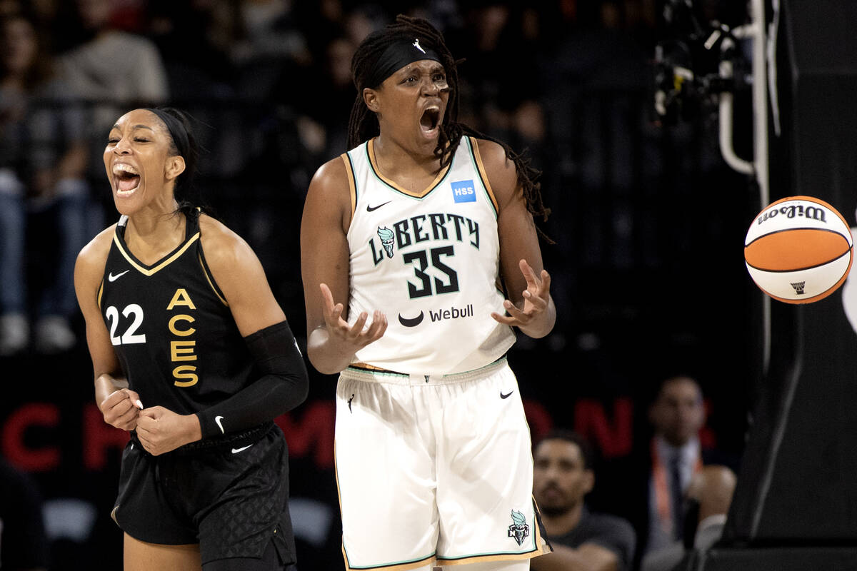 Las Vegas Aces forward A'ja Wilson (22) celebrates while New York Liberty forward Jonquel Jones ...