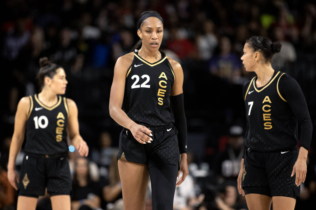 Las Vegas Aces guard Kelsey Plum (10), forward A'ja Wilson (22) and forward Alysha Clark (7) re ...