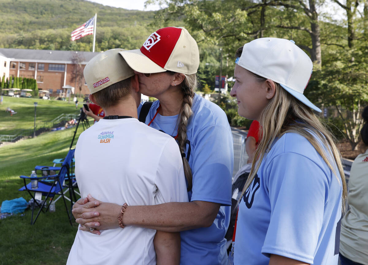 The Henderson All-Stars centerfielder Jaxson McMullen comforted by his mother Nikki after loosi ...