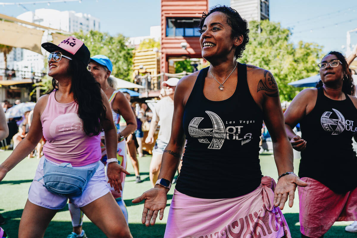 People participate in a Hawaiian themed Zumba session during a fundraiser for Maui at Container ...