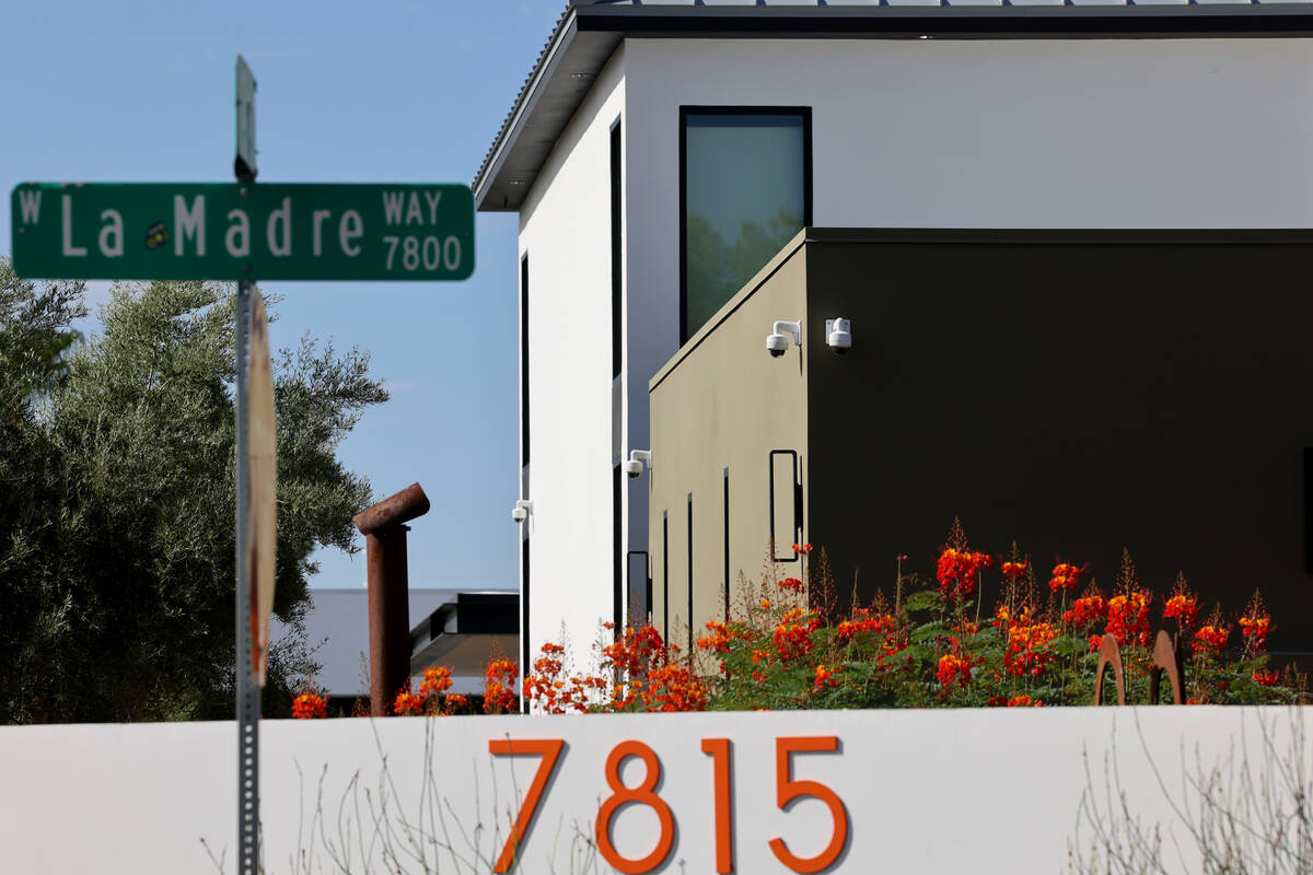 Multiple surveillance cameras are seen on a home on the corner of West La Madre Way and Conough ...