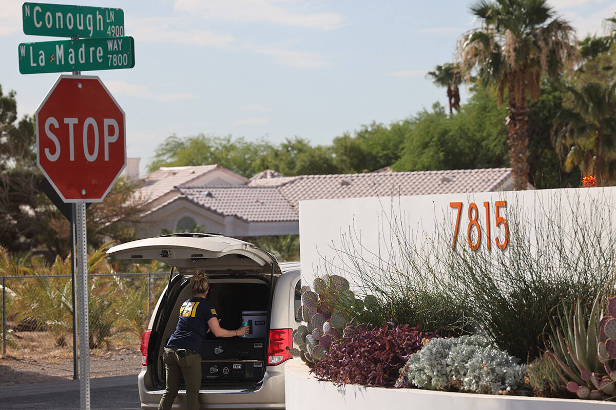 FBI officials conduct an investigation Thursday, Aug. 17, 2023, on the 7800 block of West La Ma ...