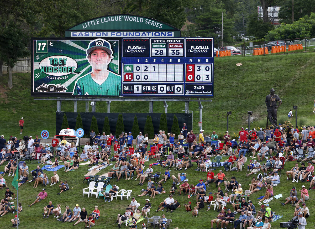 Fans watch a baseball game on the hillside overlooking Howard J. Lamade Stadium during the Litt ...