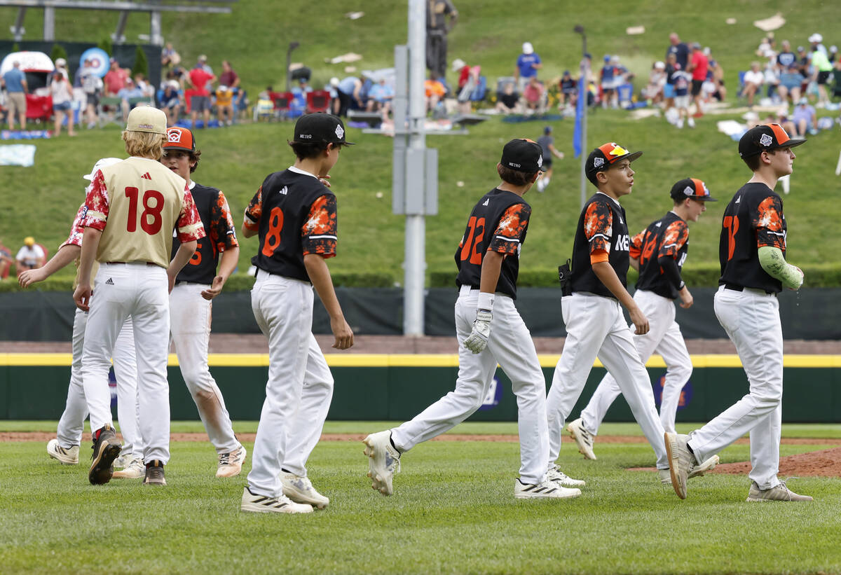 The Henderson All-Stars starting pitcher Nolan Gifford (18) shakes hands with Rhode Island pitc ...