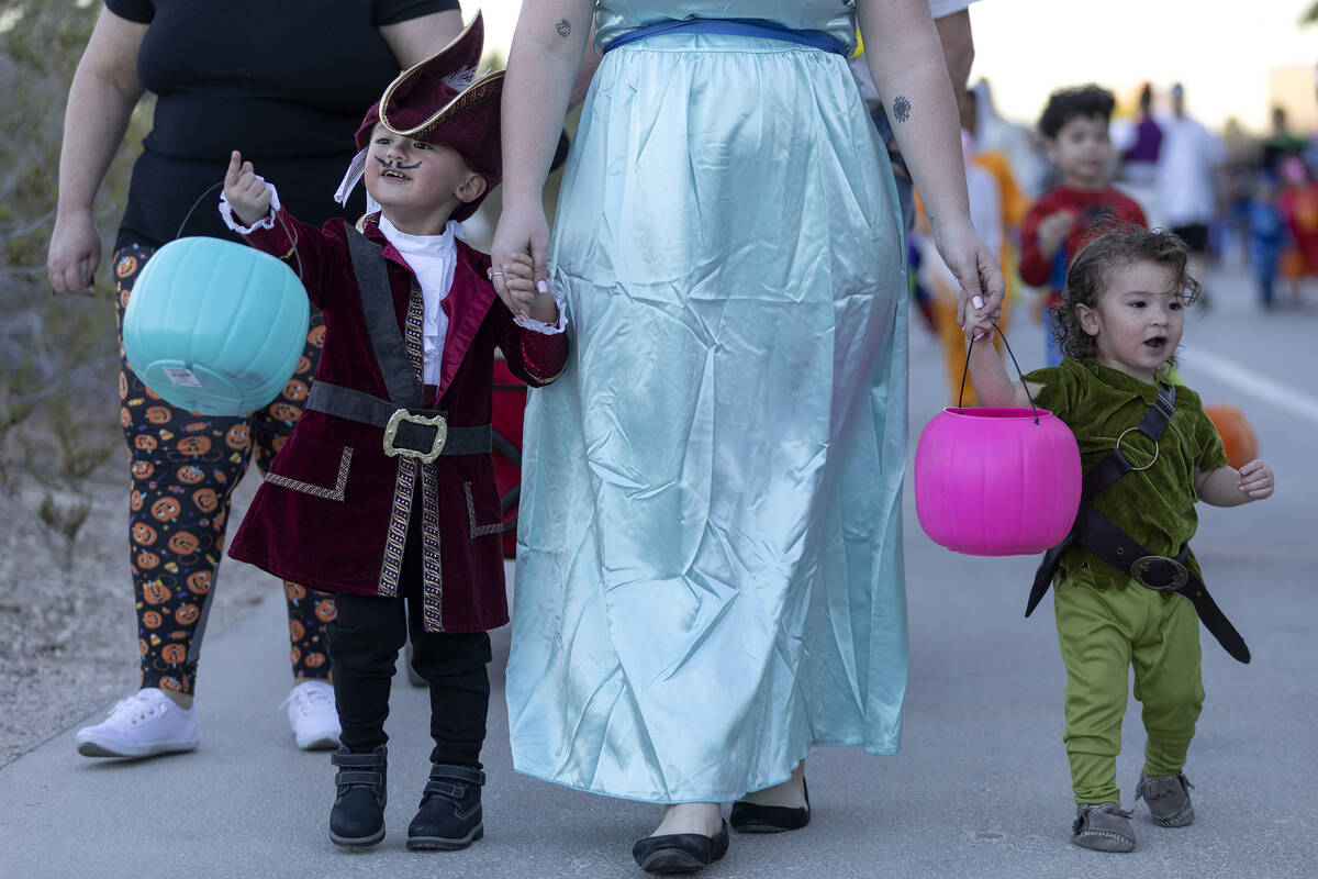 Noel O’Dell holds her sons hands, Nathan O’Dell, 3 left, and Andy O’Dell, ...