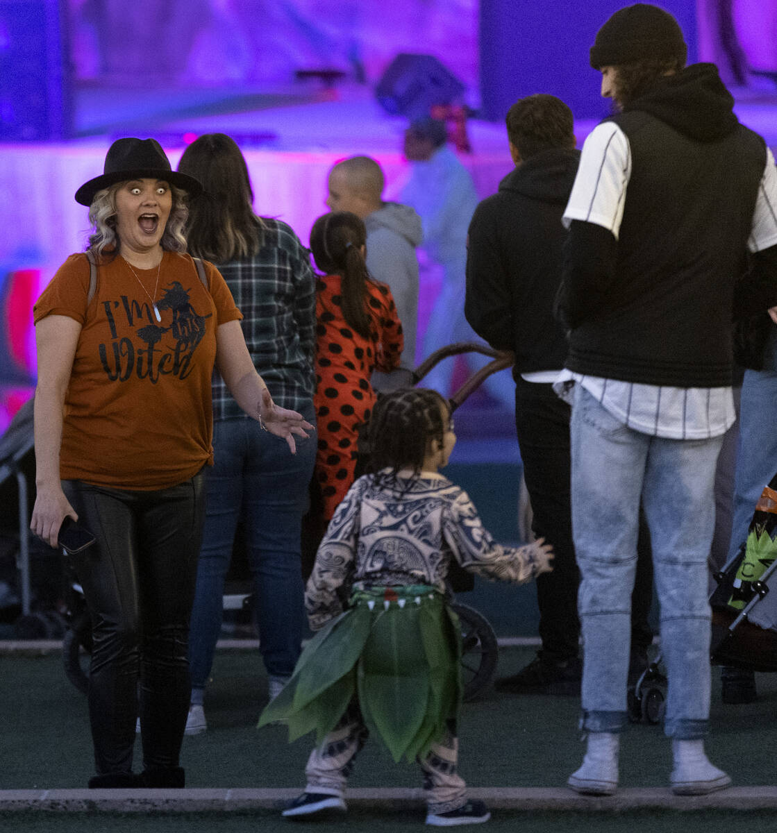 Beth Dais, left, scares her grandson Tyson Dais, 3, center, during the Haunted Harvest Hallowee ...