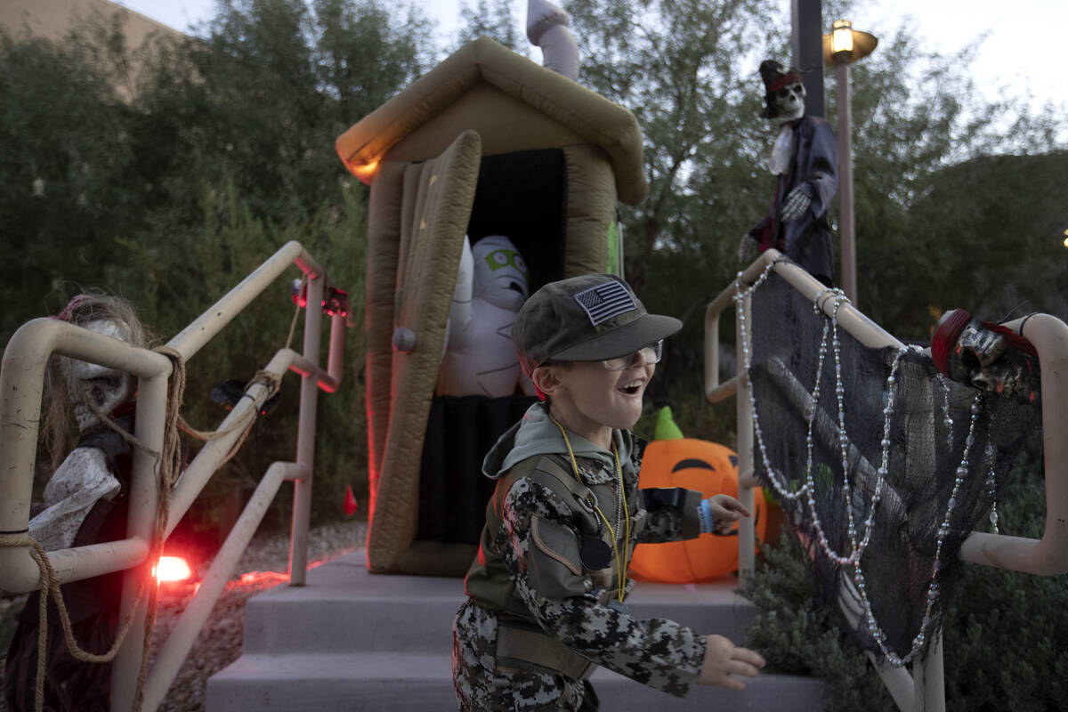 Bryce DeLappi, 5, is scared by a ghost during the Haunted Harvest Halloween event at Springs Pr ...