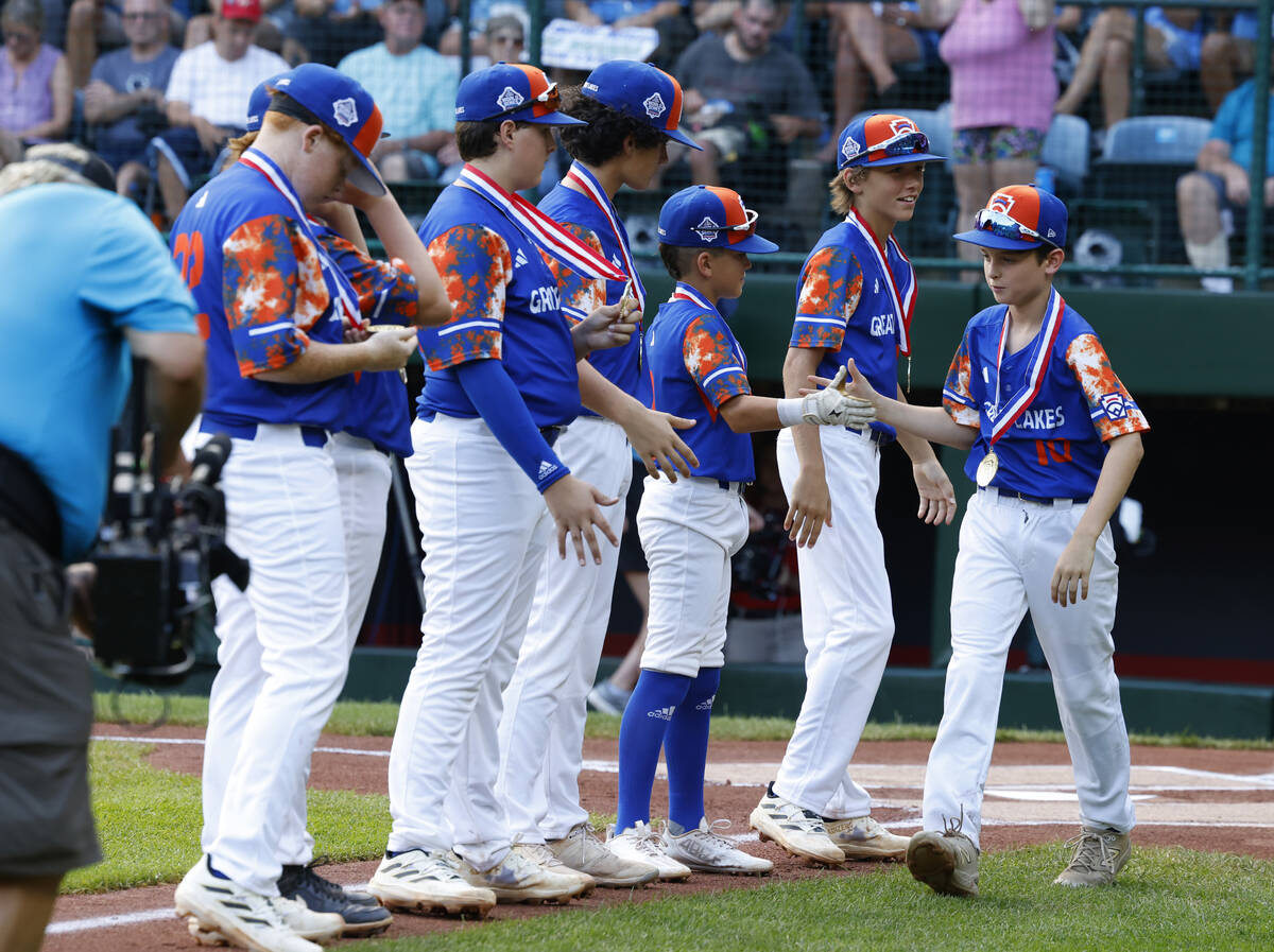 New Albany All-Stars players take the field to face El Segundo California All-Stars during the ...