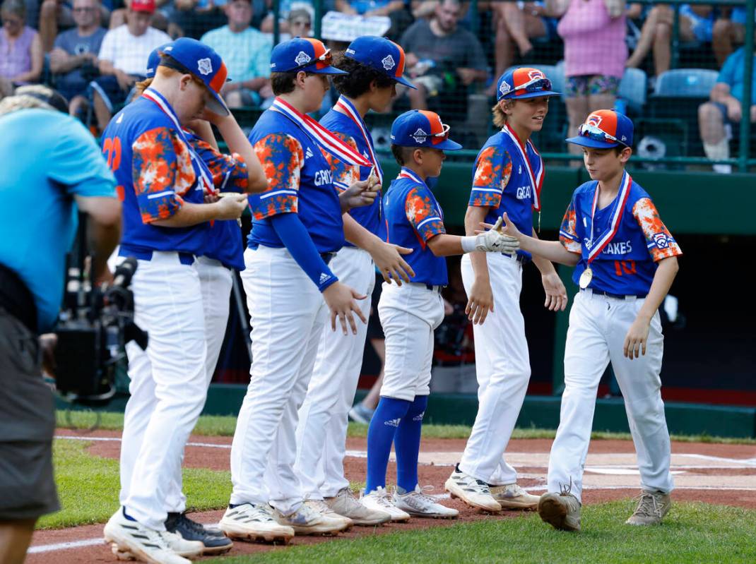 New Albany All-Stars players take the field to face El Segundo California All-Stars during the ...