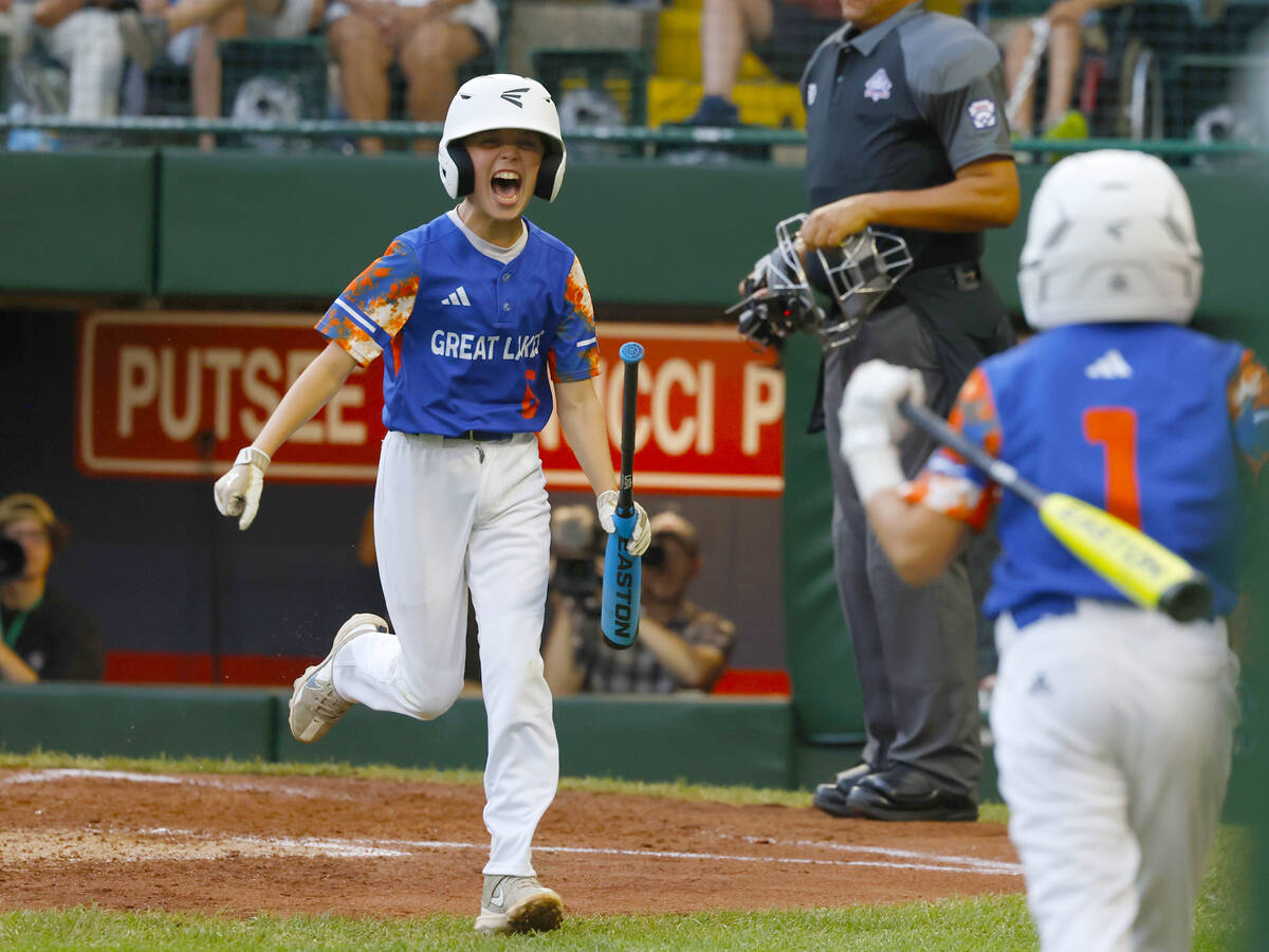 New Albany All-Stars centerfielder Eddie Bloch celebrates after scoring against El Segundo Cali ...