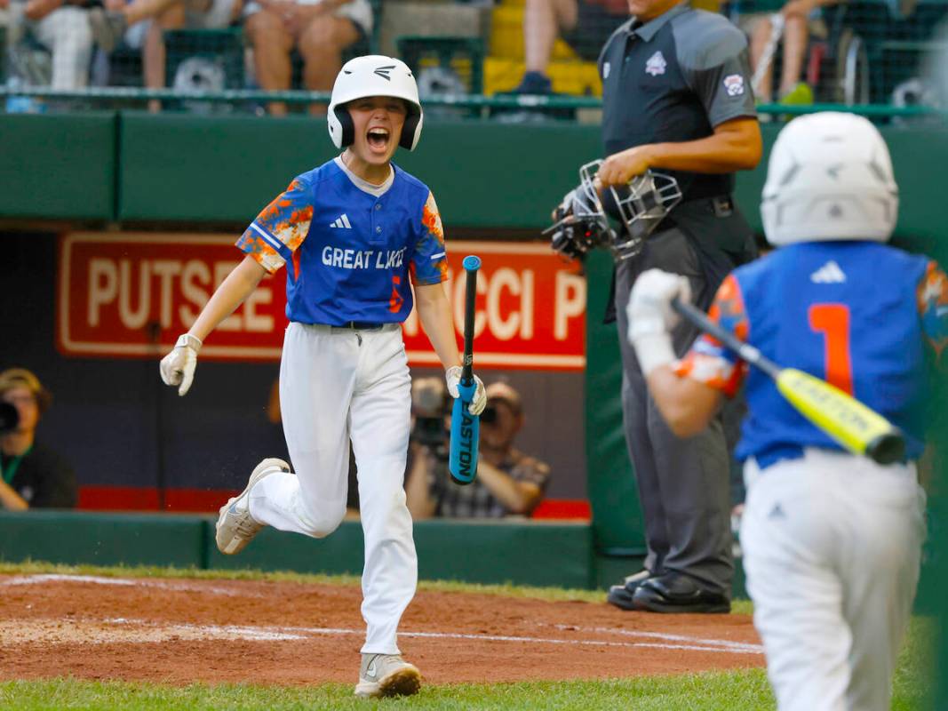 New Albany All-Stars centerfielder Eddie Bloch celebrates after scoring against El Segundo Cali ...