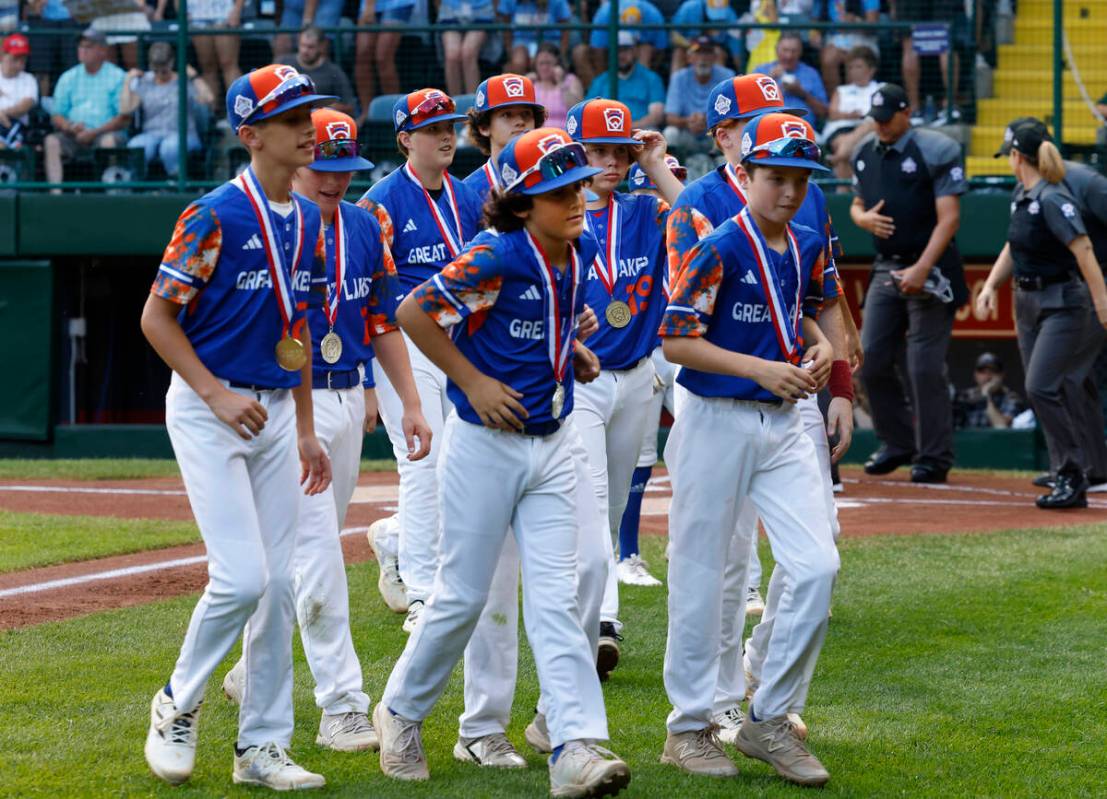 New Albany All-Stars players take the field to face El Segundo California All-Stars during the ...