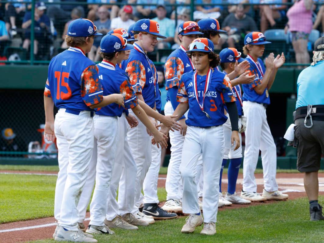 New Albany All-Stars players take the field to face El Segundo California All-Stars during the ...