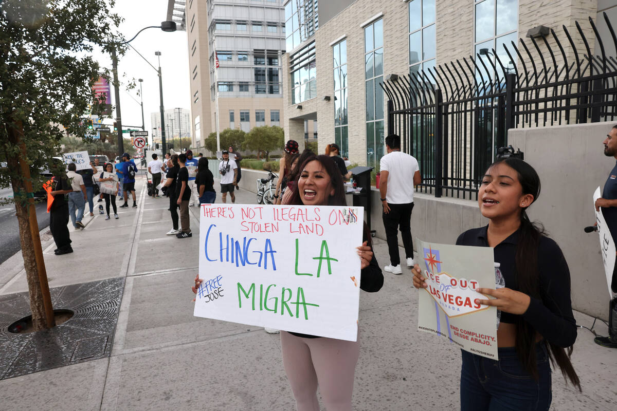 People rally outside the U.S. Immigration and Customs Enforcement offices in downtown Las Vegas ...